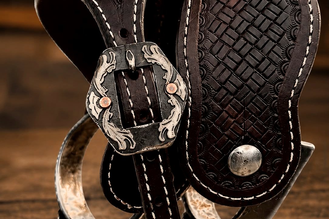 Hand-tooled Brooks Saddlery leather with silver buckle